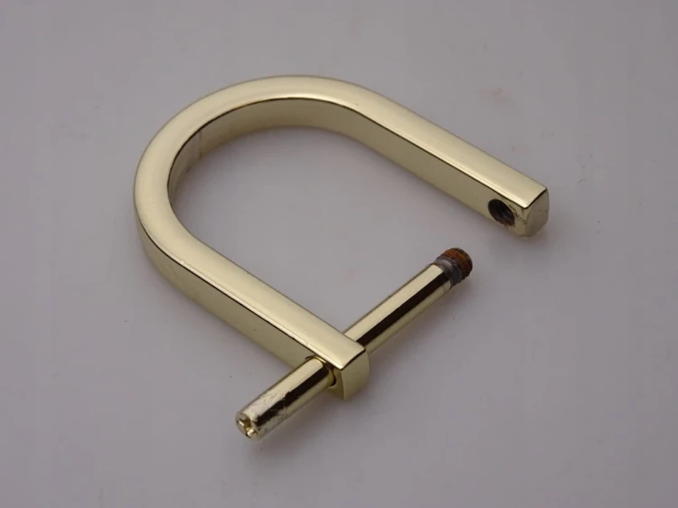 Półkole kaletnicze szlufka skręcana 20 mm złote