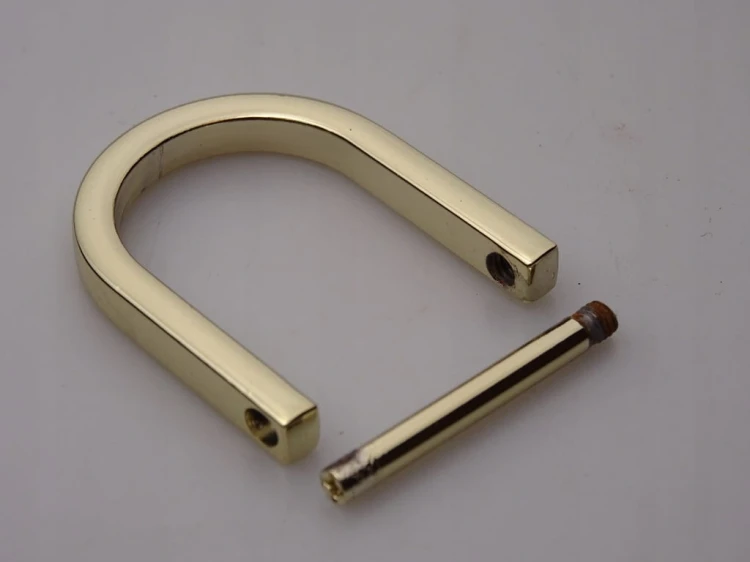 Półkole kaletnicze szlufka skręcana 20 mm złote